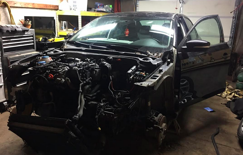 Photo: Nate Boots. Here’s Nate in the process of swapping parts from his clean, nice TDI onto a wrecked 2013 gas Jetta.